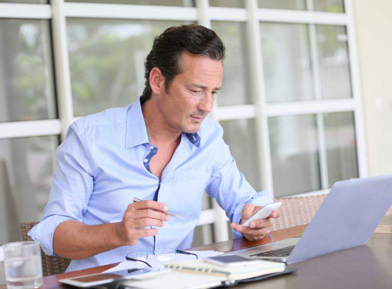 Man working from home on laptop computer