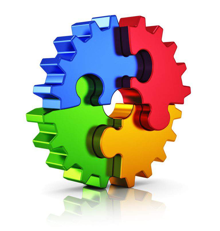 Business creativity, teamwork, partnership and success concept: metal gear from color puzzle pieces isolated on white background with reflection effect