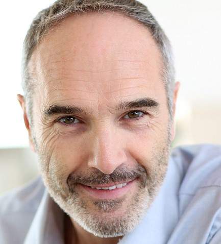 Senior businessman working on laptop computer