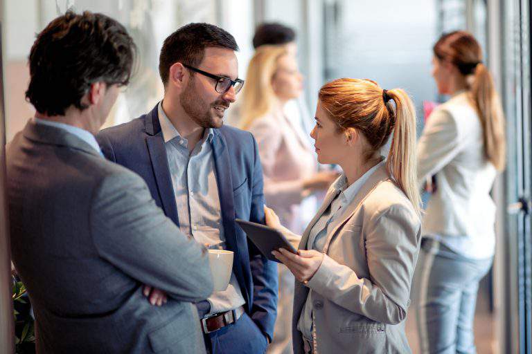 Business people having conversation during coffee break.