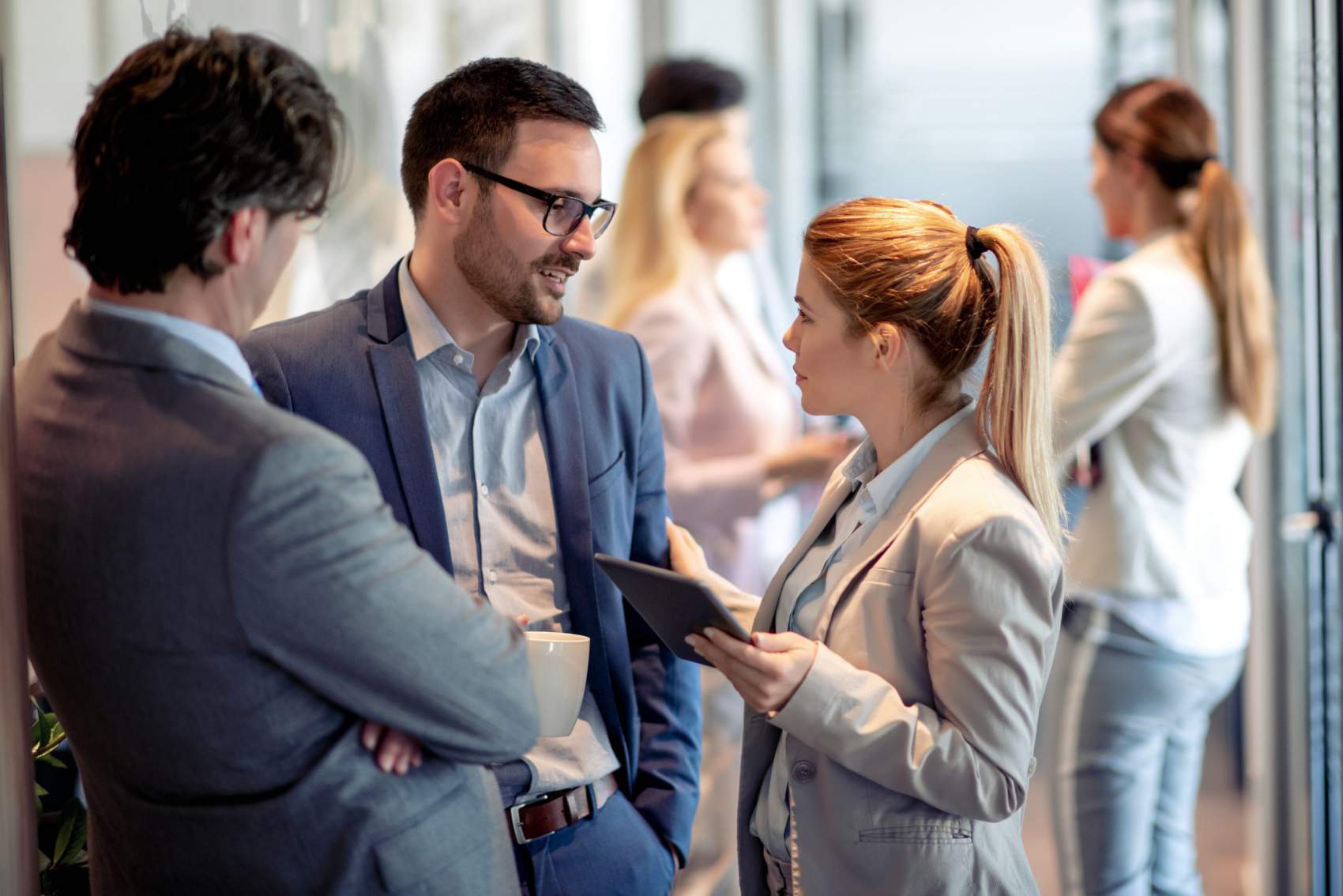 Business people having conversation during coffee break.