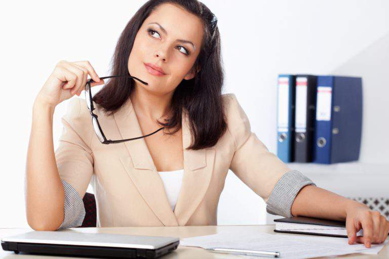 14903869 – businesswoman sitting at wrokplace and tinking
