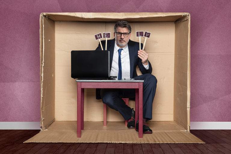 Young businessman asks for help at work